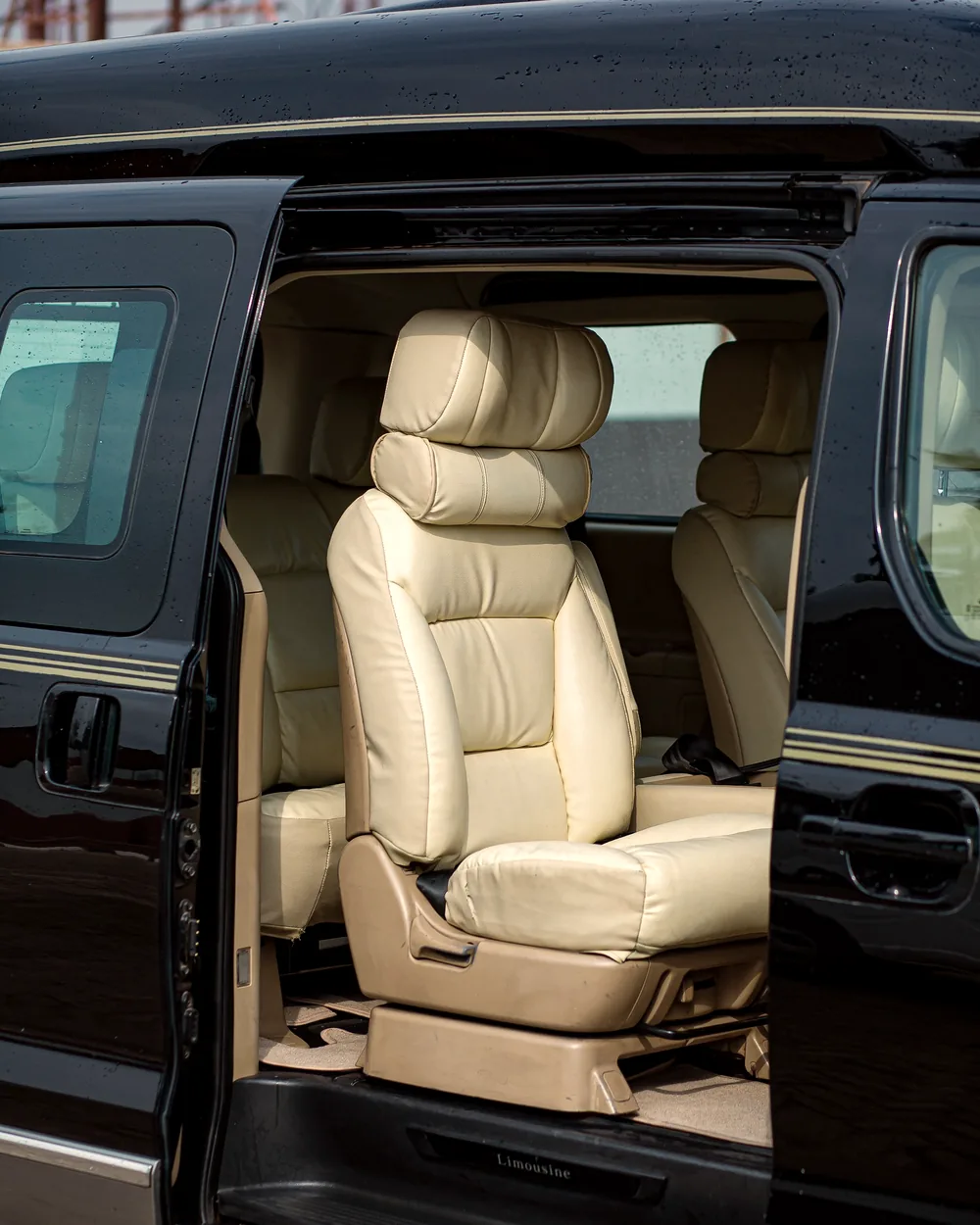 Van interior with leather captain seats and warm ambient lighting
